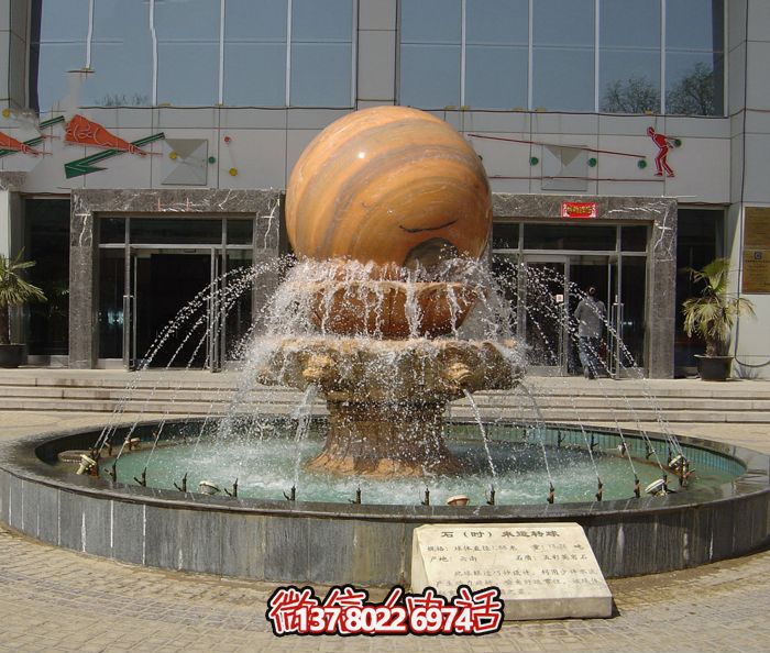 學(xué)校廣場(chǎng)擺放晚霞紅風(fēng)水球噴泉石雕